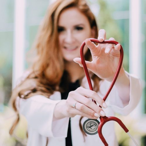 photo-of-woman-holding-red-stethoscope-3408368